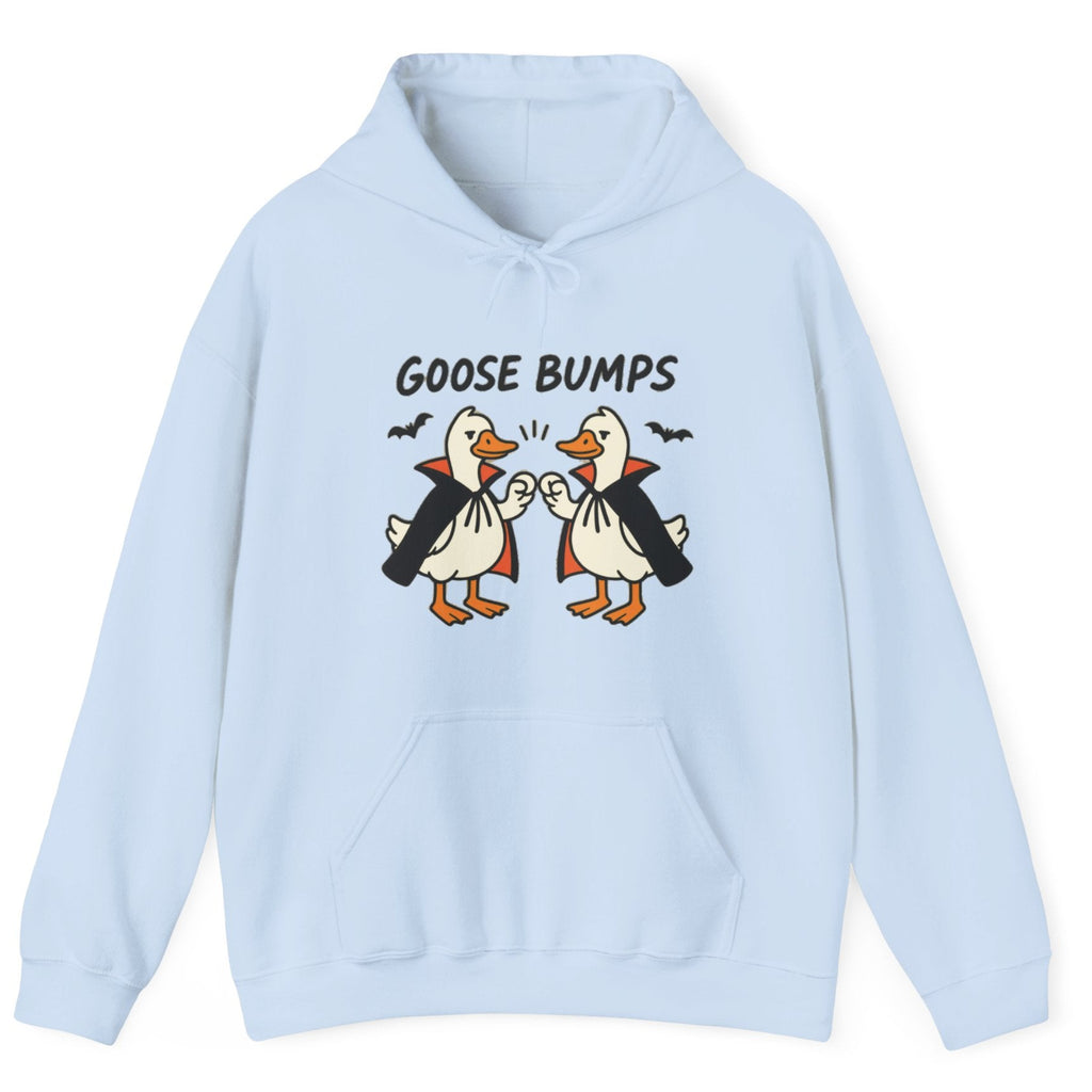 A light blue hoodie with a graphic of two geese in black and white costumes with orange beaks, under the text 'GOOSE BUMPS'. 