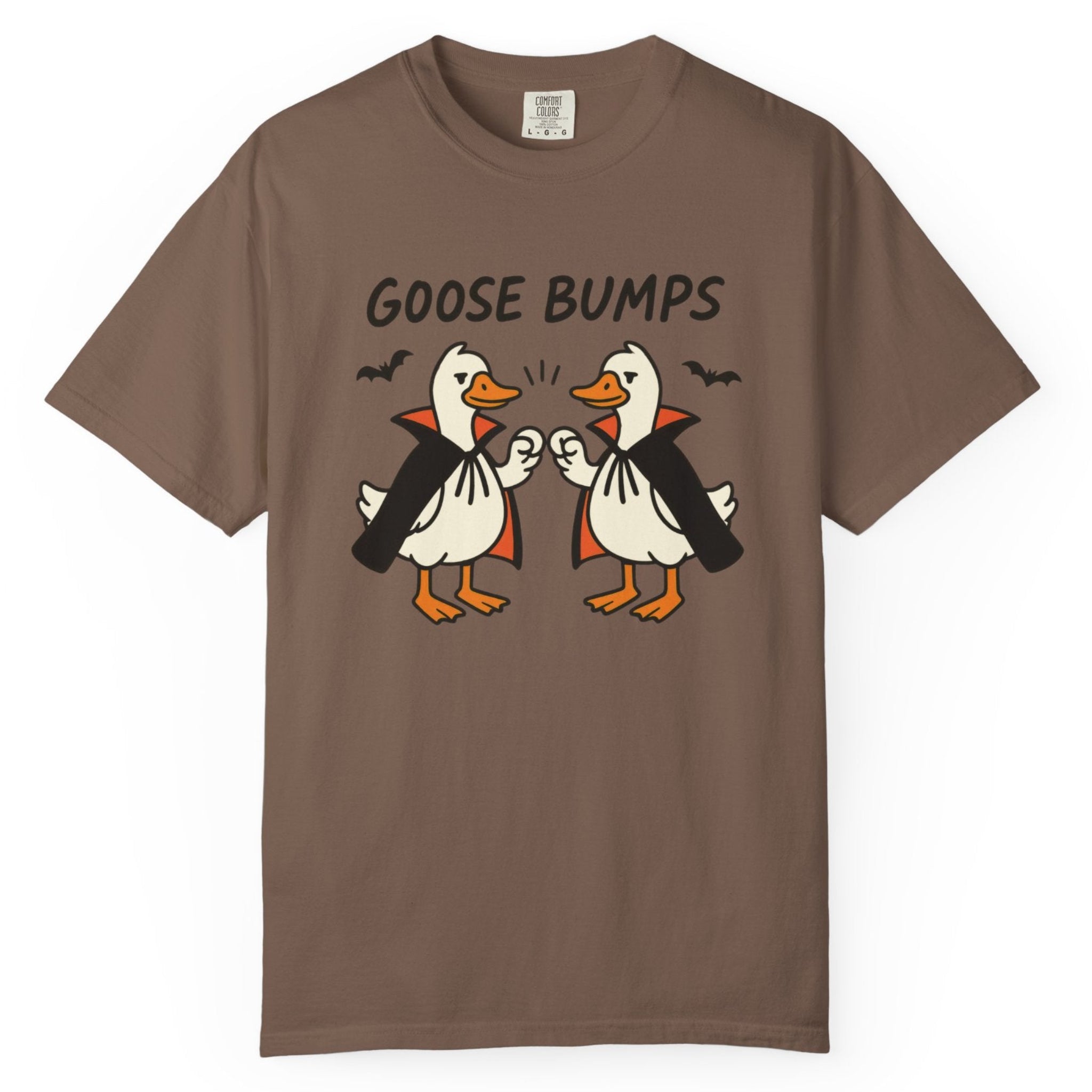 A brown short-sleeve t-shirt with a graphic of two geese in black and orange, with the text 'GOOSE BUMPS' above them