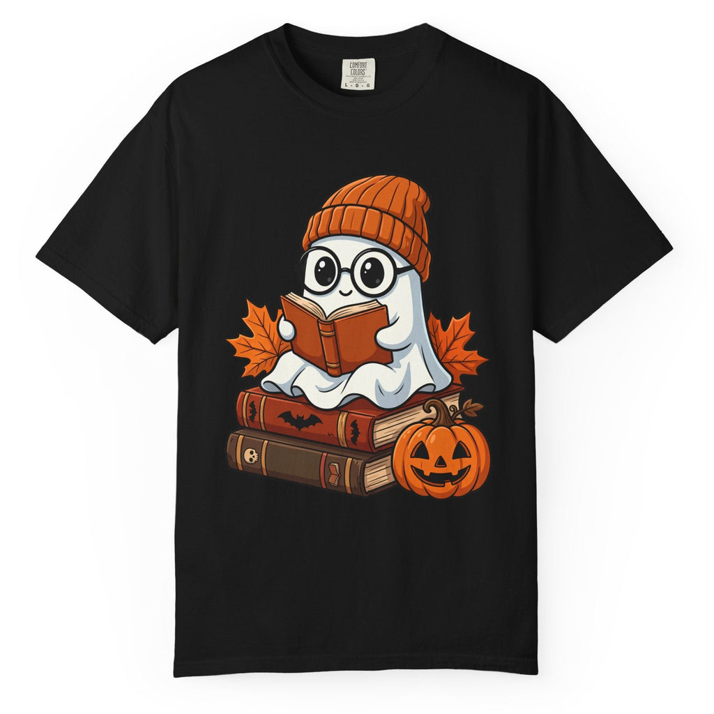 A black short-sleeve crewneck t-shirt featuring a cartoon graphic of a ghost wearing glasses and an orange knit beanie, sitting on books and reading an orange book, with autumn leaves and a jack-o'-lantern pumpkin.