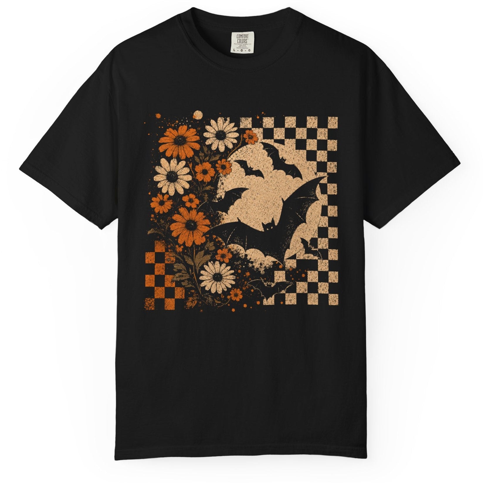 A black short-sleeve crewneck t-shirt featuring a distressed graphic print of a witch's hat, bats, orange and white flowers, and a checkered pattern on the front, displayed against a solid white background.