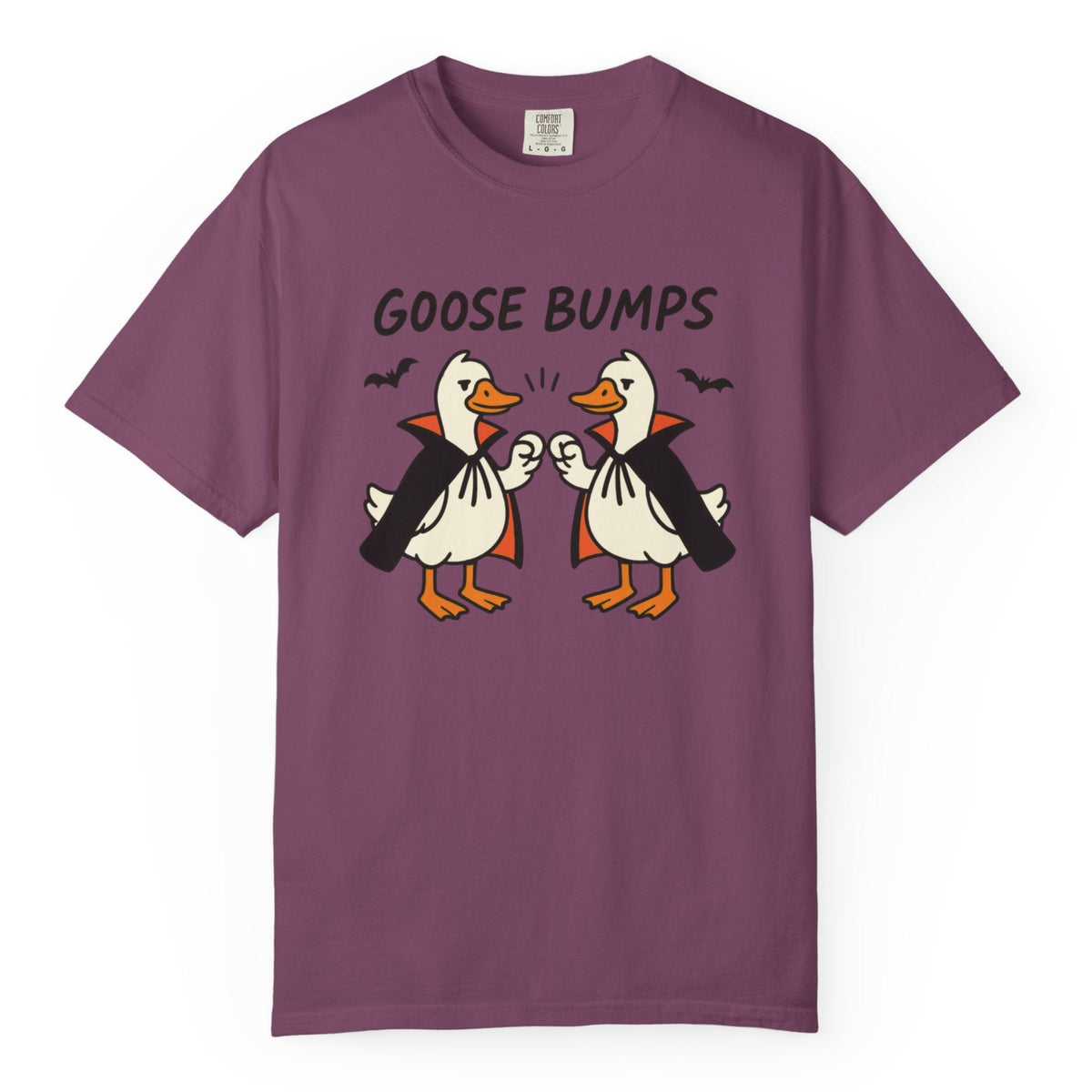 A berry short-sleeve t-shirt with a graphic of two geese in black and orange, with the text 'GOOSE BUMPS' above them