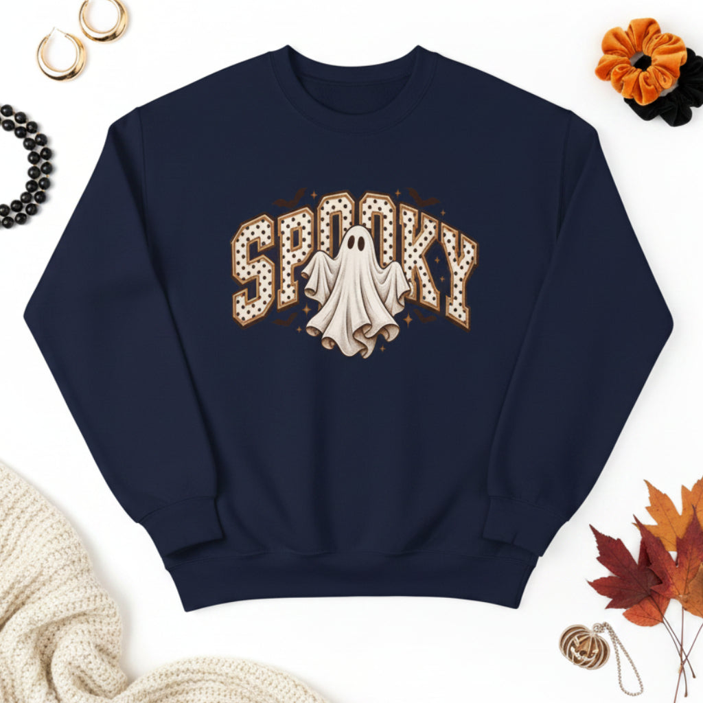 A navy blue crewneck sweatshirt featuring a 'Spooky' graphic on the chest with a white ghost and brown polka-dot lettering, displayed on a clean white background.