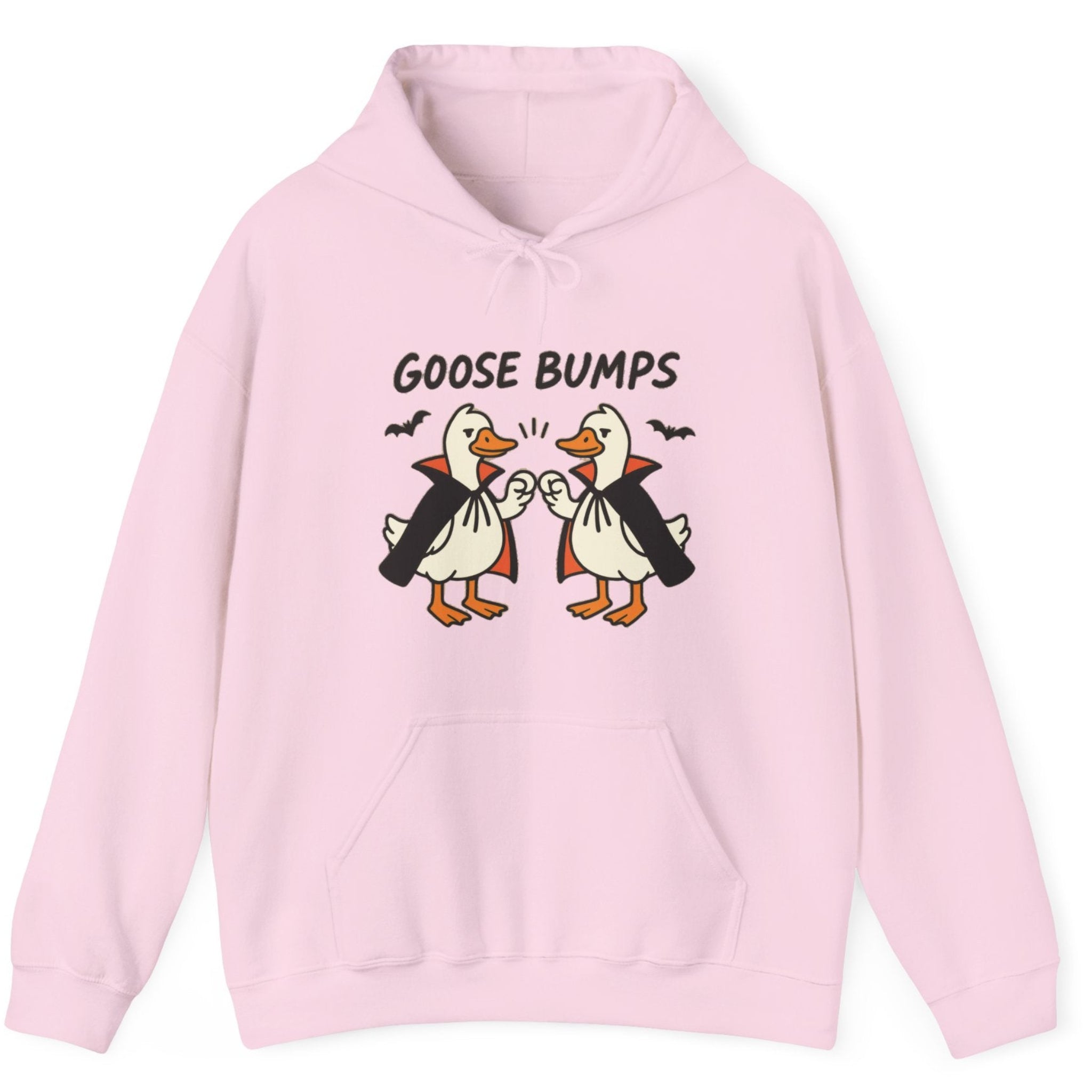 A light pink pullover hoodie featuring a graphic of two cartoon geese in vampire costumes bumping fists with the text 'GOOSE BUMPS' above them, displayed on a clean white background.