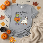 A heather gray short-sleeve crewneck t-shirt featuring a Halloween graphic of a green frog in a pumpkin costume and a white dog in a ghost costume, with the text 'off to be Spooky' above them.