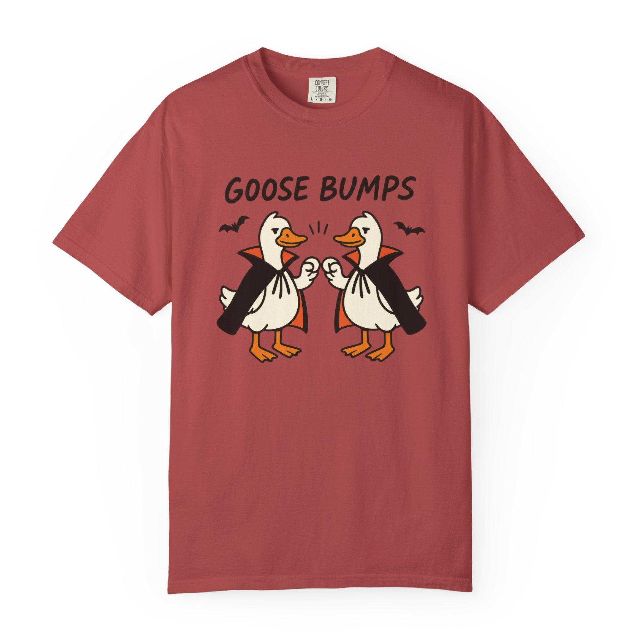 A crimson short-sleeve t-shirt with a graphic of two geese in black and orange, with the text 'GOOSE BUMPS' above them