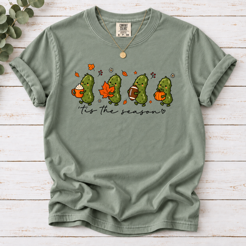 Bay ’tis the season tee with four pickles holding a latte, maple leaf, football and pumpkin.