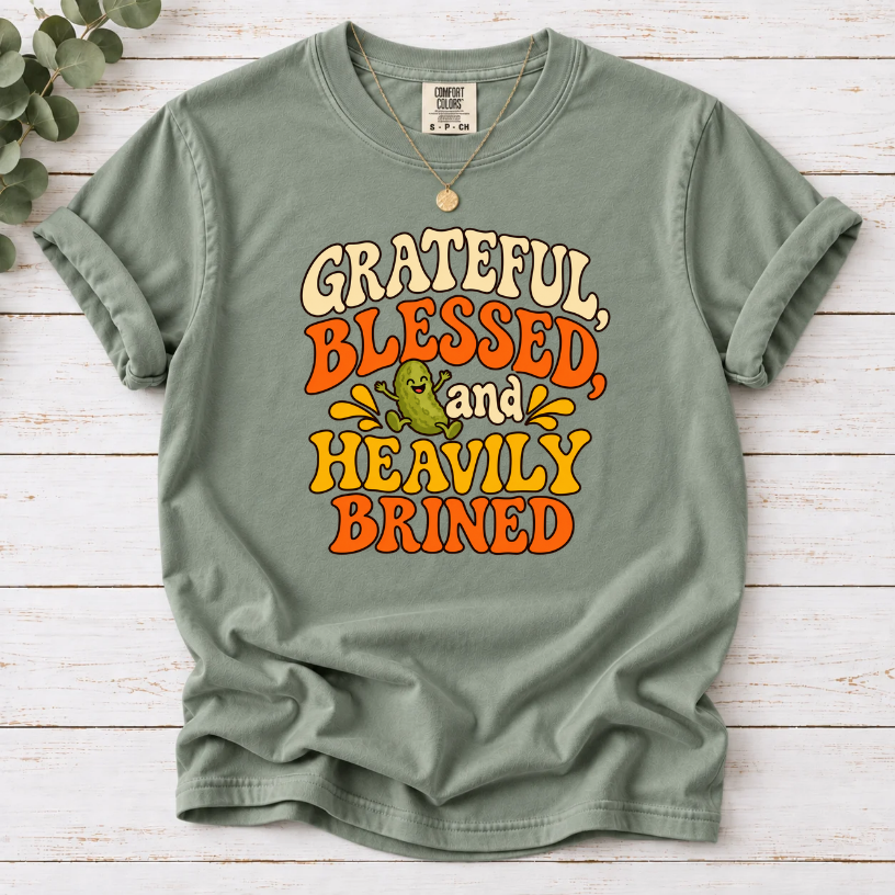 Bay T-shirt with ‘Grateful, Blessed and Heavily Brined’ retro lettering and a smiling green pickle