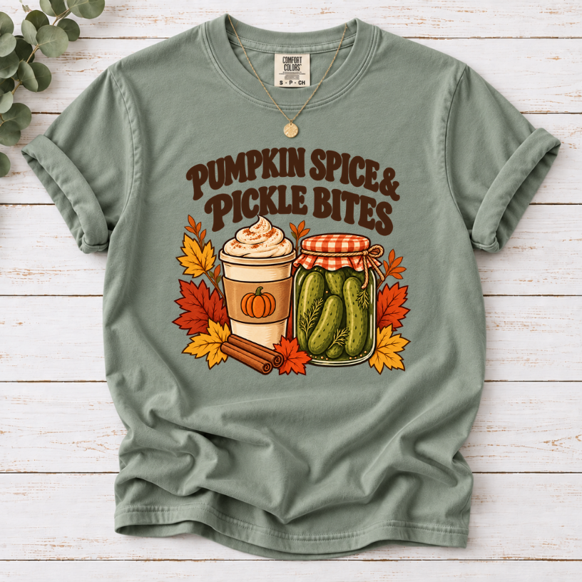 Vintage Pumpkin Spice & Pickle Bites design with dark brown lettering, a coffee cup, pickle jar, autumn leaves, and cinnamon sticks on Bay Shirt