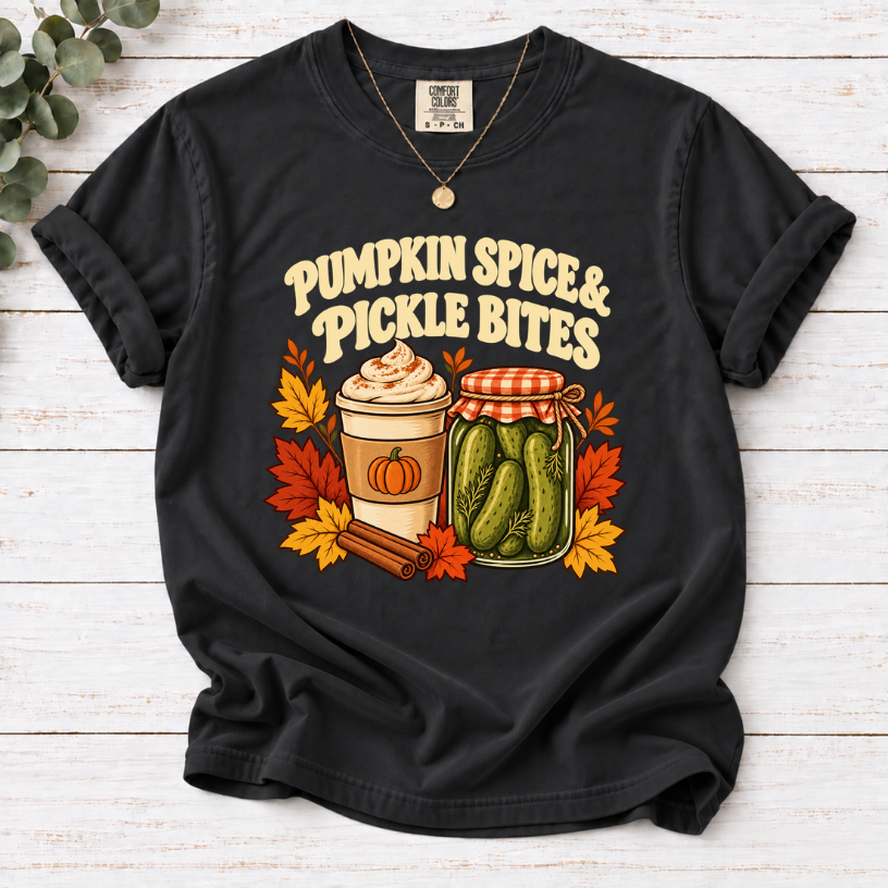 Vintage Pumpkin Spice & Pickle Bites design with dark brown lettering, a coffee cup, pickle jar, autumn leaves, and cinnamon sticks on Black Shirt