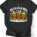 Black T-shirt with “Fa La La La Dill” text and three pickle carolers wearing red hats and scarves, holding songbooks.