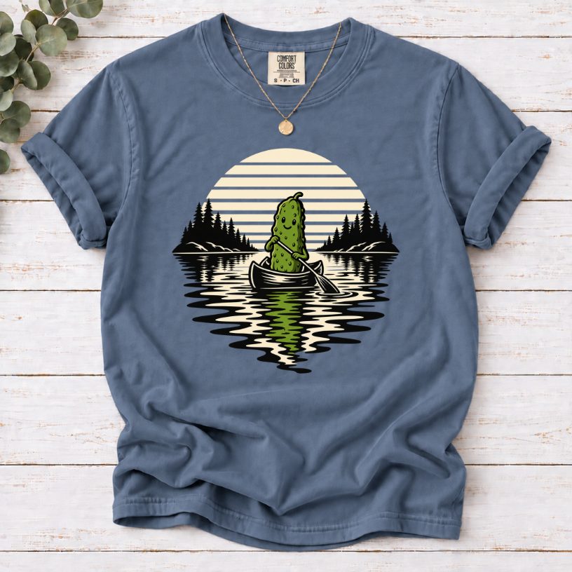 Canoeing pickle under a retro sunset on a Blue Jean T-shirt.