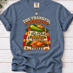 Blue Jean T-shirt with The Thankful Hierarchy design featuring a crowned dill pickle, stuffing, turkey, and fall leaves
