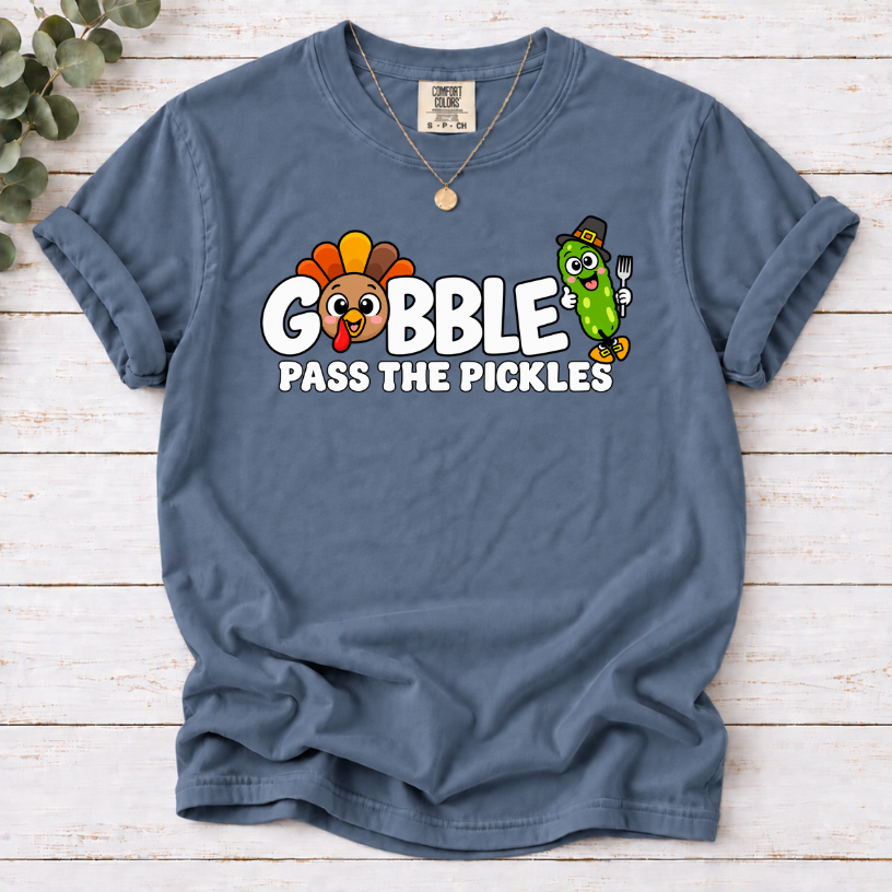 Blue Jean T-shirt with ‘Gobble Pass the Pickles’ lettering, a cartoon turkey and a pilgrim pickle holding a fork.