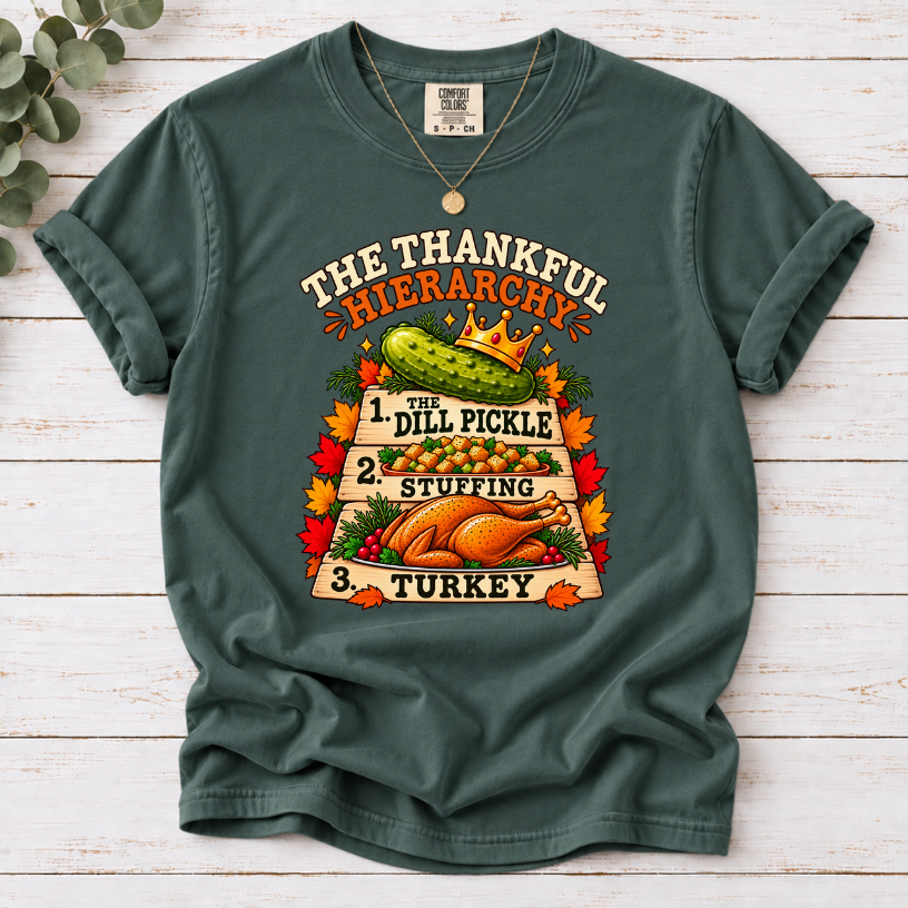 Blue Spruce T-shirt with The Thankful Hierarchy design featuring a crowned dill pickle, stuffing, turkey, and fall leaves