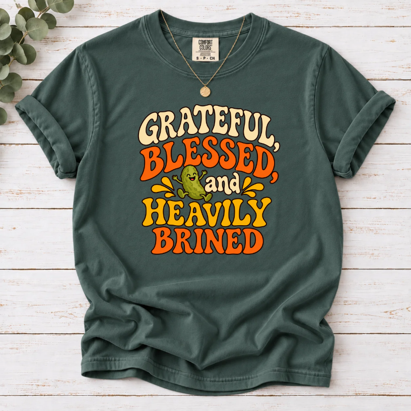 Blue Spruce T-shirt with ‘Grateful, Blessed and Heavily Brined’ retro lettering and a smiling green pickle