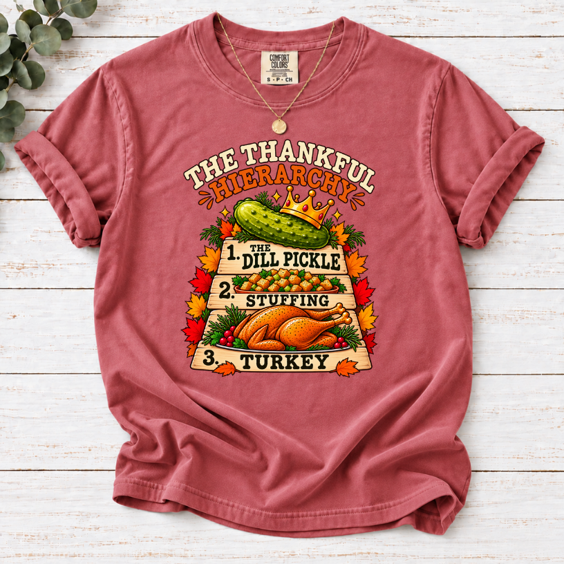Crimson T-shirt with The Thankful Hierarchy design featuring a crowned dill pickle, stuffing, turkey, and fall leaves