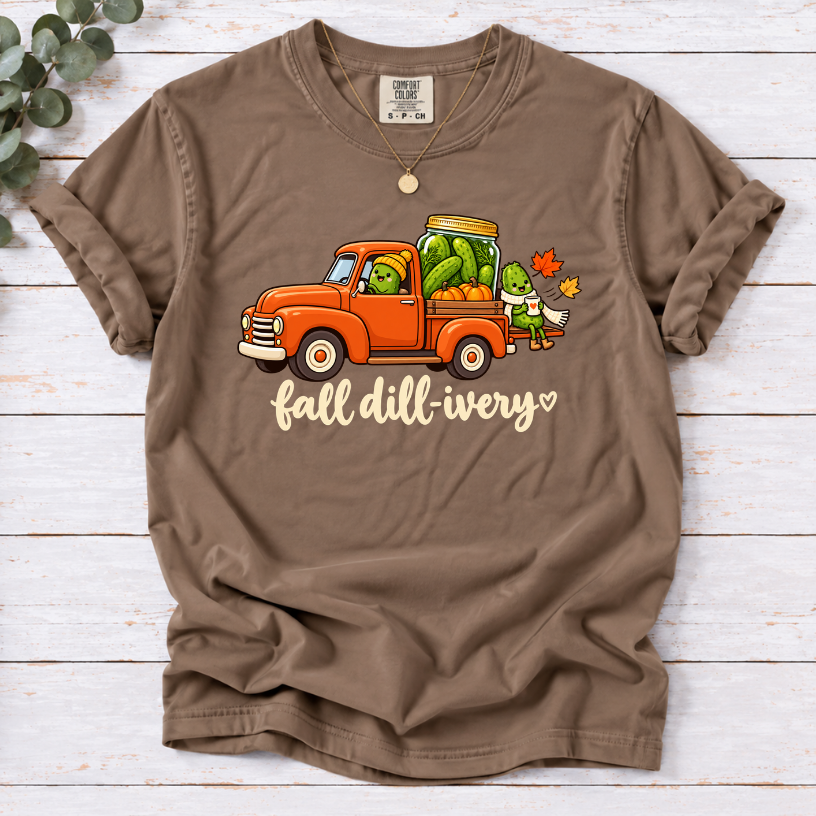Espresso Fall dill-ivery’ tee featuring an orange vintage truck, pickle characters, a pickle jar, pumpkins and autumn leaves