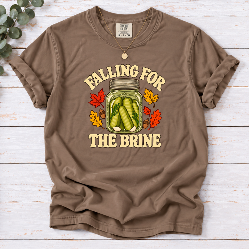 Espresso T-shirt with “Falling for the Brine” lettering and a pickle jar surrounded by autumn leaves and acorns.