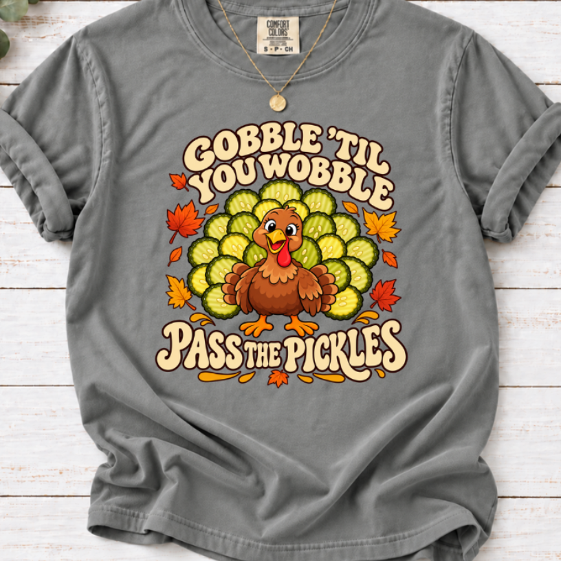 Grey Thanksgiving tee with a turkey, pickle-slice tail and fall leaves, reading ‘Gobble ’Til You Wobble, Pass the Pickles.