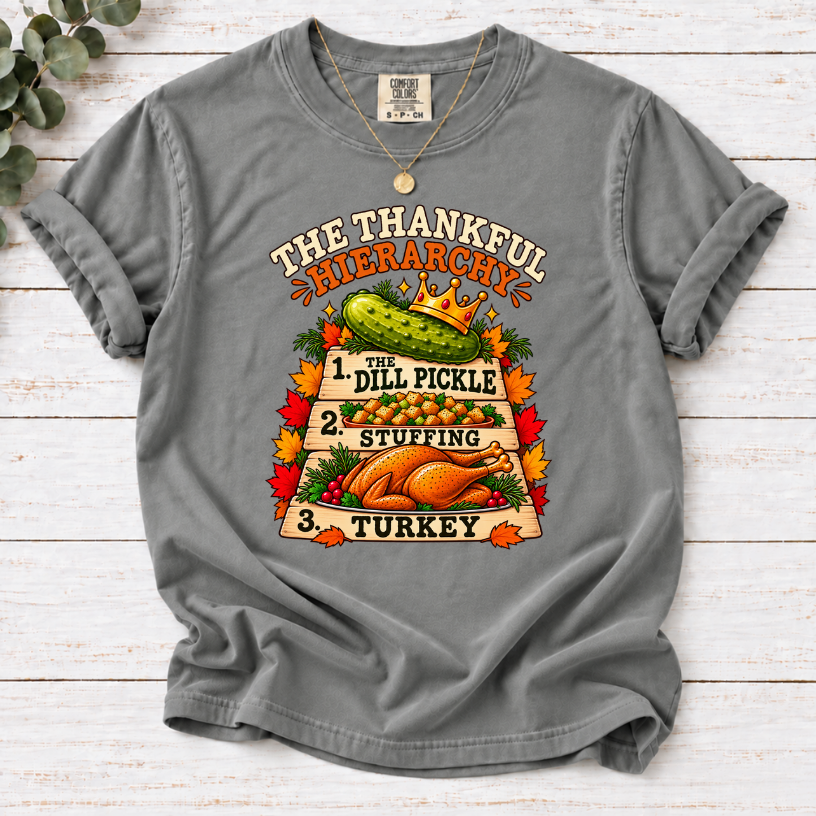 Grey T-shirt with The Thankful Hierarchy design featuring a crowned dill pickle, stuffing, turkey, and fall leaves
