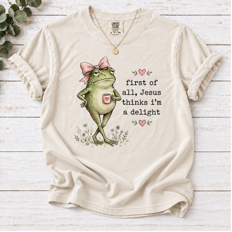 Christian Frog Funny Graphic Tee — "First of All, Jesus Thinks I'm a Delight" Coffee T-Shirt