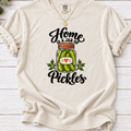 Ivory T-shirt with a heart-labeled pickle jar graphic and black ‘Home Is a Jar of Pickles’ lettering