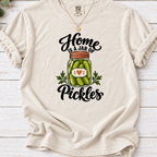 Ivory T-shirt with a heart-labeled pickle jar graphic and black ‘Home Is a Jar of Pickles’ lettering