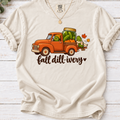 Ivory Fall dill-ivery’ tee featuring an orange vintage truck, pickle characters, a pickle jar, pumpkins and autumn leaves
