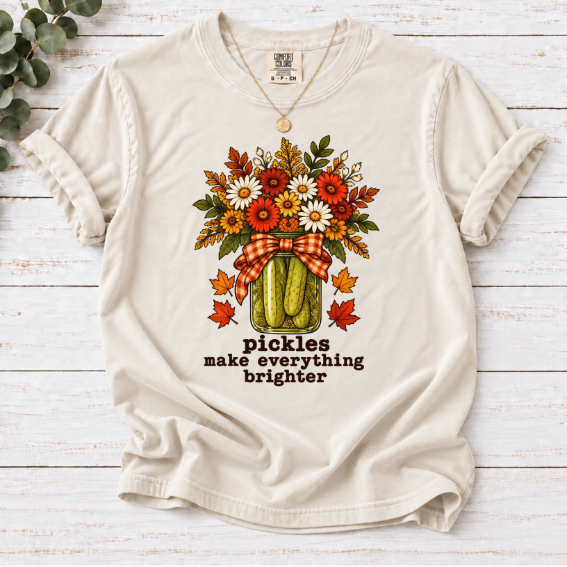 Ivory tee with pickle jar flower bouquet, gingham bow and the text “pickles make everything brighter”