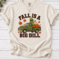 ivory Fall Is a Big Dill shirt design featuring a pickle wearing sunglasses in a vintage green pickup truck with pumpkins and autumn leaves.