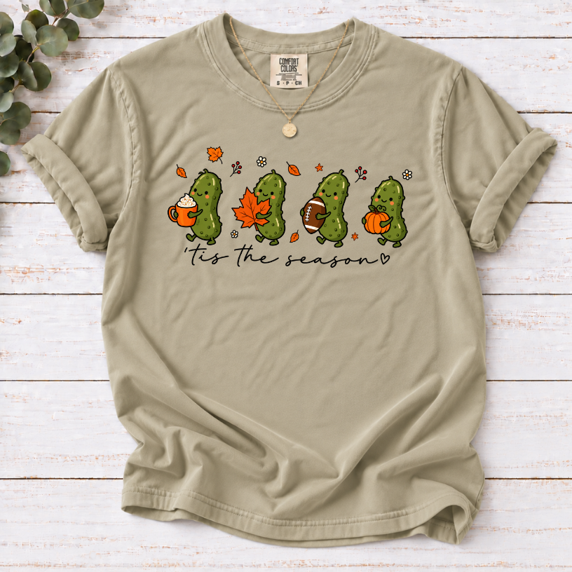 Khaki tis the season tee with four pickles holding a latte, maple leaf, football and pumpkin.