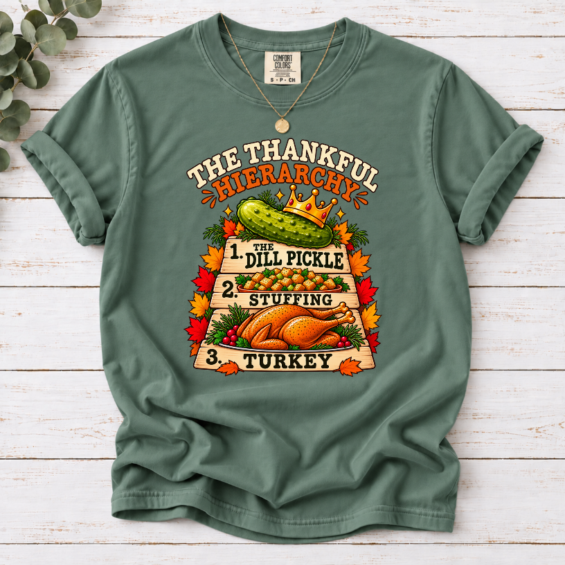 Light Green T-shirt with The Thankful Hierarchy design featuring a crowned dill pickle, stuffing, turkey, and fall leaves