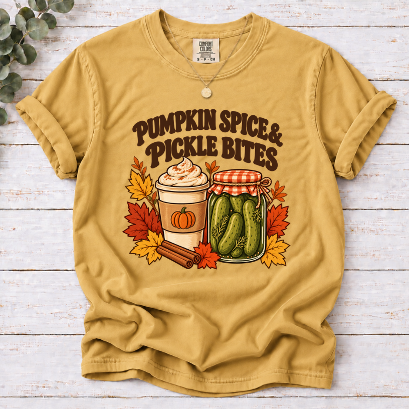 Vintage Pumpkin Spice & Pickle Bites design with dark brown lettering, a coffee cup, pickle jar, autumn leaves, and cinnamon sticks on mustard shirt
