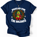 Navy Pickled for the Holidays’ T-shirt with a smiling pickle in a red scarf inside a Christmas wreath.”