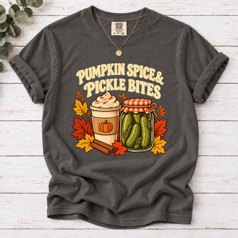 Vintage Pumpkin Spice & Pickle Bites design with dark brown lettering, a coffee cup, pickle jar, autumn leaves, and cinnamon sticks on pepper shirt