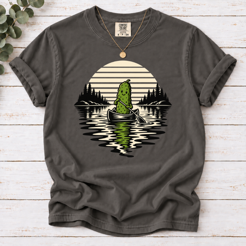 Canoeing pickle under a retro sunset on a Pepper T-shirt.