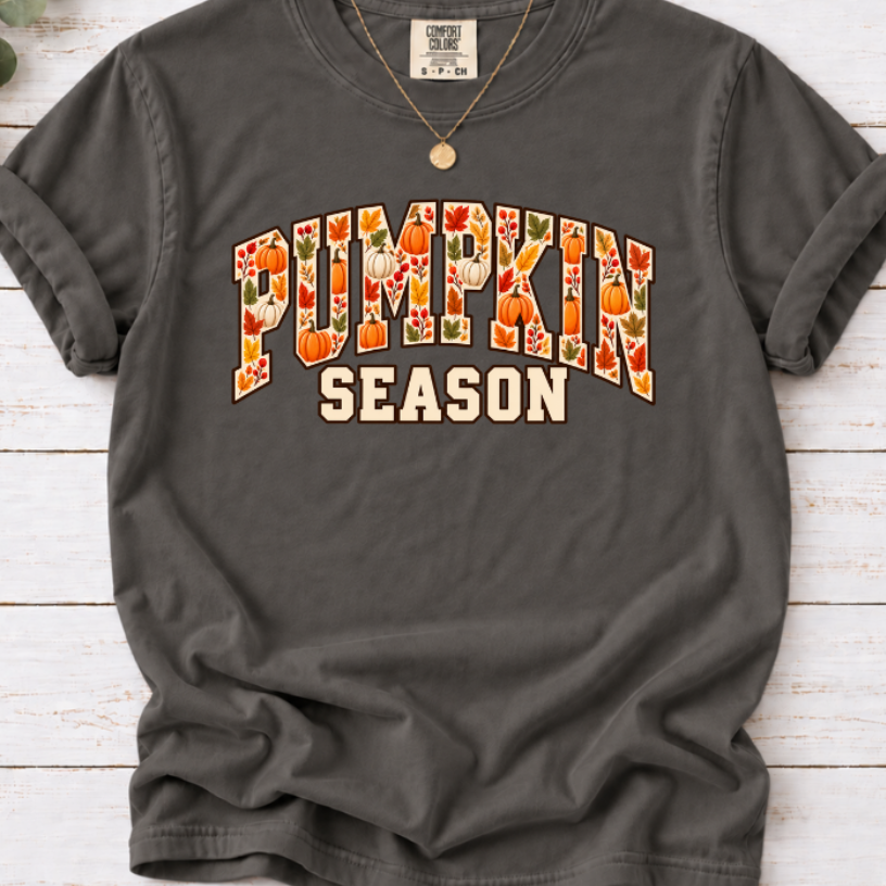  pepper T-shirt with Pumpkin Season lettering filled with orange and white pumpkins and autumn leaves.