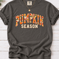  pepper T-shirt with Pumpkin Season lettering filled with orange and white pumpkins and autumn leaves.