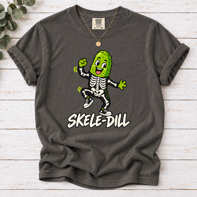 Pepper Skele-Dill T-shirt featuring a dancing pickle in a skeleton costume with SKELE-DILL lettering