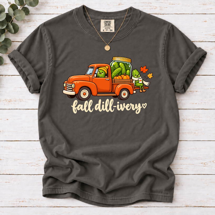 Pepper Fall dill-ivery’ tee featuring an orange vintage truck, pickle characters, a pickle jar, pumpkins and autumn leaves