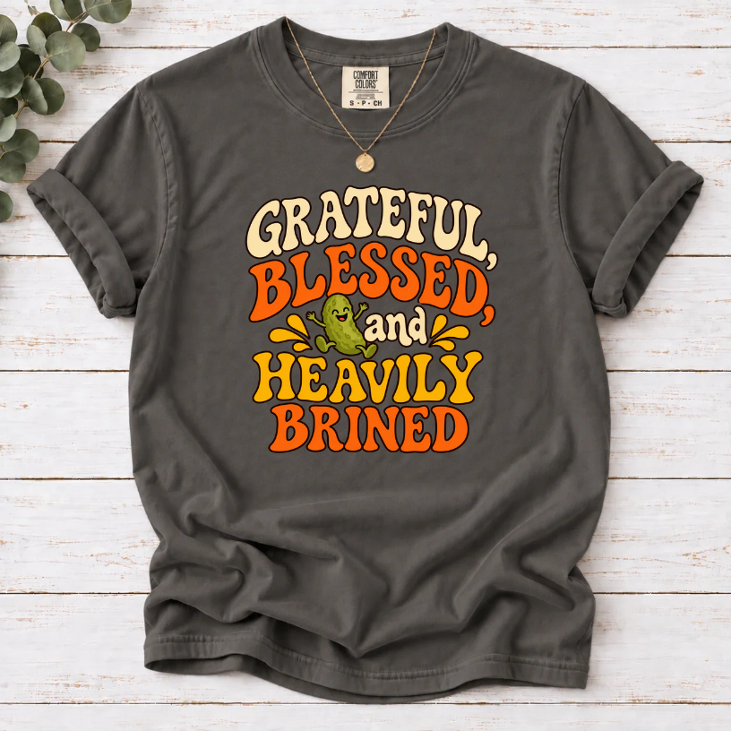 Pepper T-shirt with ‘Grateful, Blessed and Heavily Brined’ retro lettering and a smiling green pickle