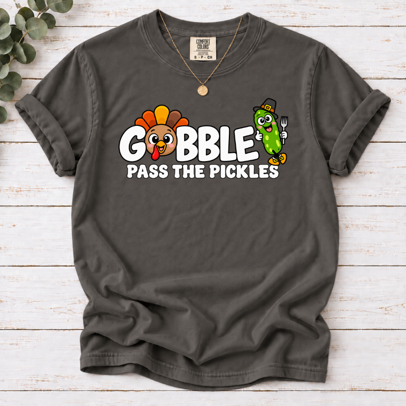 Pepper T-shirt with ‘Gobble Pass the Pickles’ lettering, a cartoon turkey and a pilgrim pickle holding a fork.