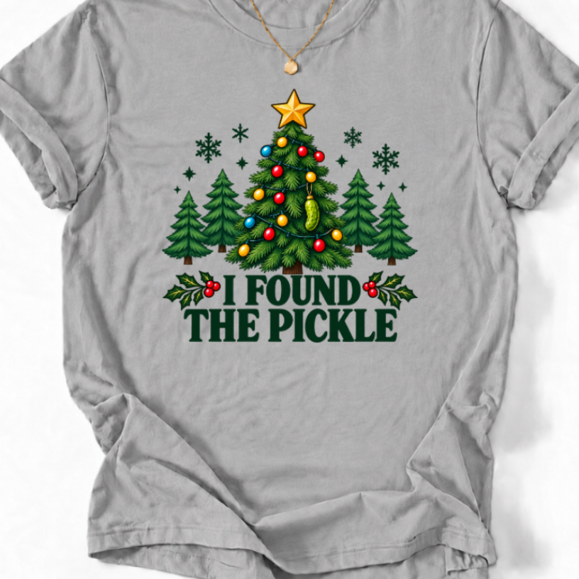Sports Grey I Found the Pickle Christmas T-shirt design featuring a tree with colorful lights, a gold star, and a hanging green pickle ornament.