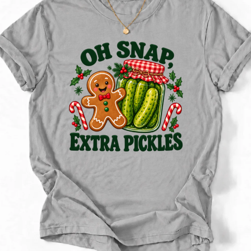 Sport Grey T-shirt with “Oh Snap, Extra Pickles” lettering, a smiling gingerbread character, and a pickle jar surrounded by candy canes and holly.