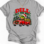 Sport Grey Dill All the Way’ T-shirt featuring a Santa-hat pickle, a red truck loaded with pickle jars, and snowy trees