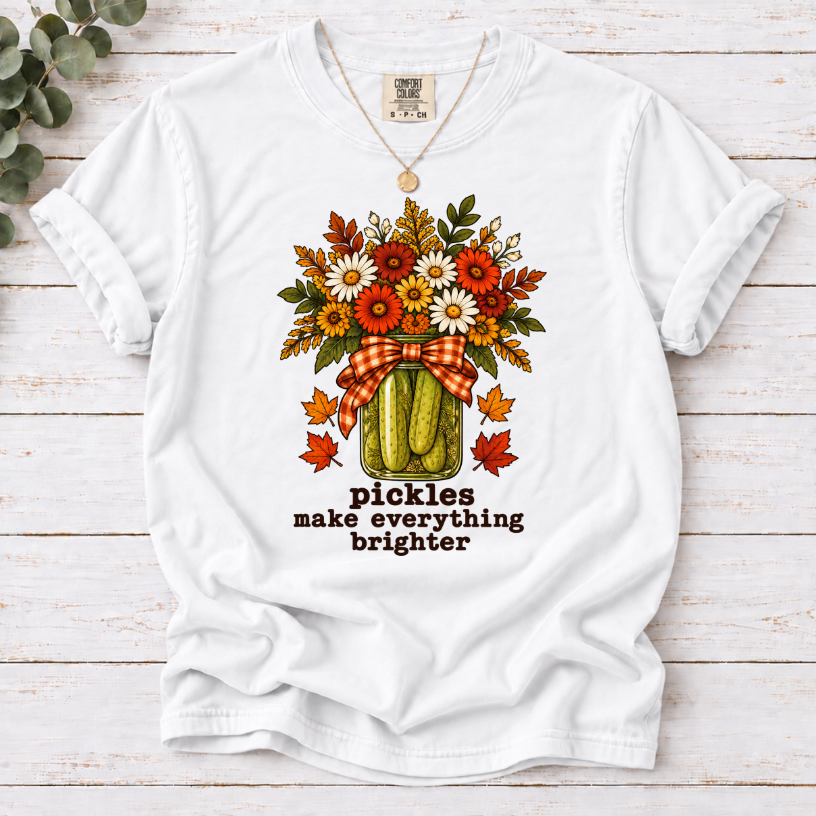 White  tee with pickle jar flower bouquet, gingham bow and the text “pickles make everything brighter”